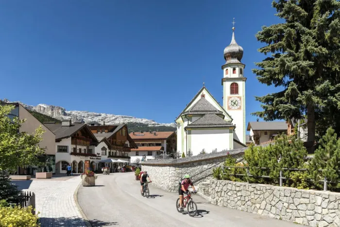 Framed Print : Cycling in San Cassiano village, Val Badia, Trentino Alto Adige, Italy, Europe