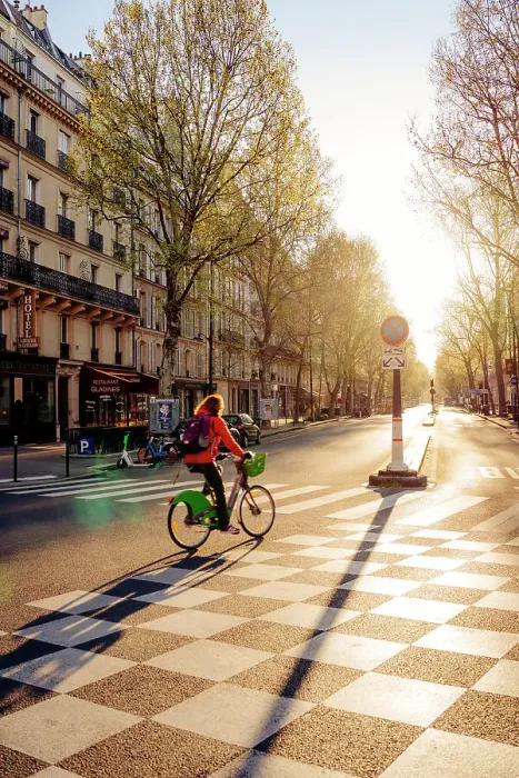 Framed Print : Cyclist at dawn on the deserted streets of Paris, France Framed Print : Cyclist at dawn on the deserted streets of Paris, France