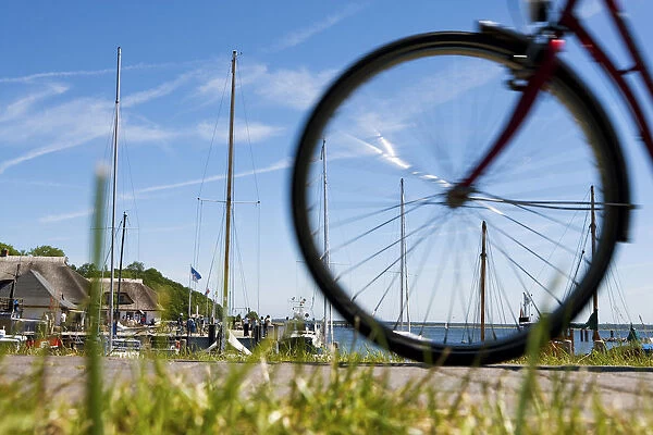 Cyclist in the harbour of Kloster, Hiddensee Island, Mecklenburg-Western Pomerania