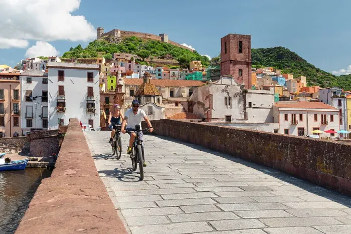 Framed Print : Cyclists on a bridge, Bosa, Oristano district, Sardinia, Italy Framed Print : Cyclists on a bridge, Bosa, Oristano district, Sardinia, Italy