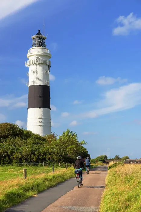 Framed Print : Cyclists passing Langer Christian lighthouse, Kampen, Sylt, Schleswig Holstein, Germany Framed Print : Cyclists passing Langer Christian lighthouse, Kampen, Sylt, Schleswig Holstein, Germany