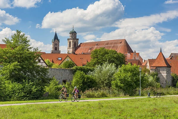 Cyclists riding on a bike lane, Dinkelsbuhl, Bavaria, Germany