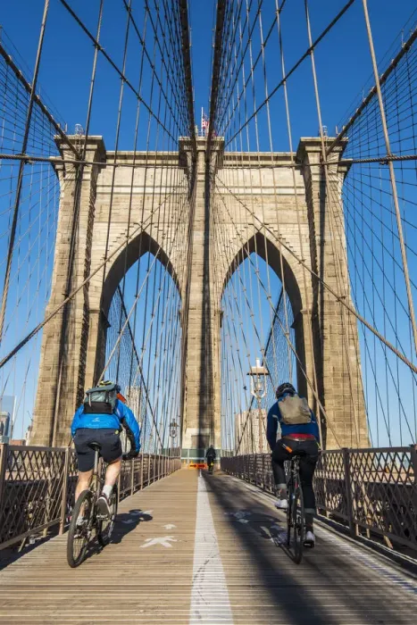 Framed Print : Cyclists riding their bikes on Brooklyn Bridge, New York, USA Framed Print : Cyclists riding their bikes on Brooklyn Bridge, New York, USA