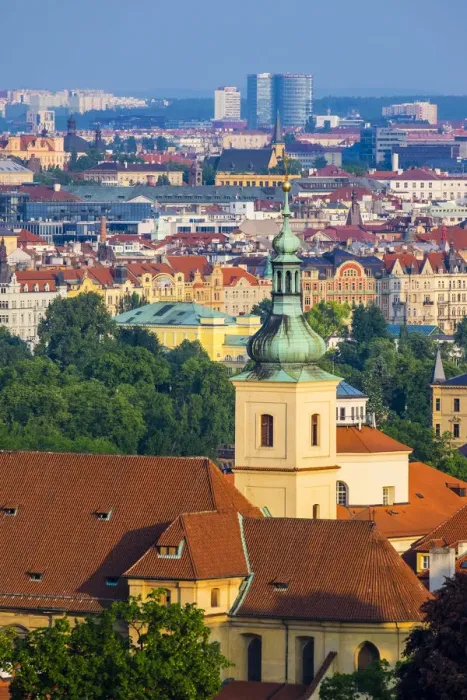 Framed Print : Czech Republic, Prague. Steeple of Church of Our Lady Victorious and buildings in
