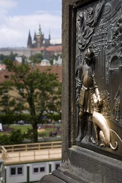 Czech Republic, Prague. Touching the plaque at the base of the John of Nepomuk Statue