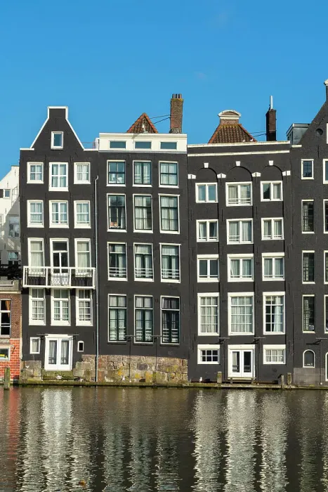 Framed Print : Dancing houses near river against sky, Damrak, Amsterdam, Netherlands Framed Print : Dancing houses near river against sky, Damrak, Amsterdam, Netherlands