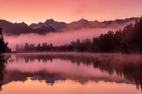 Dawn Mist Below Mt. Cook & Mt. Tasman, Lake Matheson, South Island, New Zealand