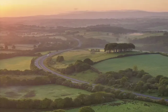 Framed Print : Dawn over the Nearly Home Trees, otherwise known as Cookworthy Knapp, and the A30 road to Cornwall, Lifton, Devon, England. Spring (May) 2023 Framed Print : Dawn over the Nearly Home Trees, otherwise known as Cookworthy Knapp, and the A30 road to Cornwall, Lifton, Devon, England. Spring (May) 2023