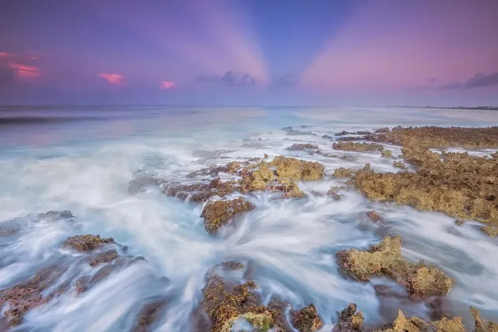 Framed Print : Daybreak on the Caribbean Sea along the rugged ironshore of Grand Cayman in the Cayman Islands, British West Indies