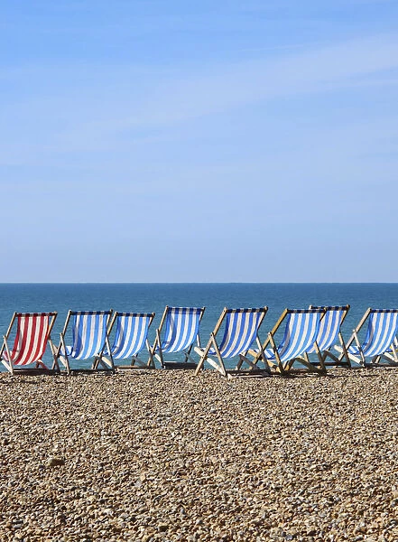 Deck chairs on Brighton beach, Brighton, Sussex, UK