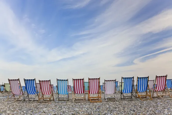 Framed Print : Deckchairs on pebble beach, Sidmouth, Devon, UK Framed Print : Deckchairs on pebble beach, Sidmouth, Devon, UK