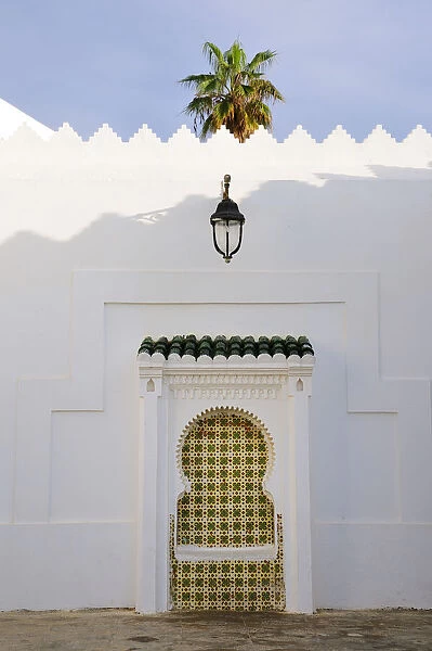 Decorated fountain inside Asilah medina. Morocco