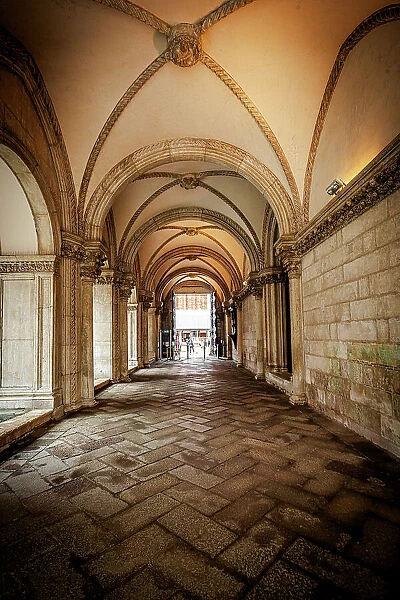 Decorated vaulted arches in the arcade of the historic Doge's Palace, Venice, Veneto, Italy
