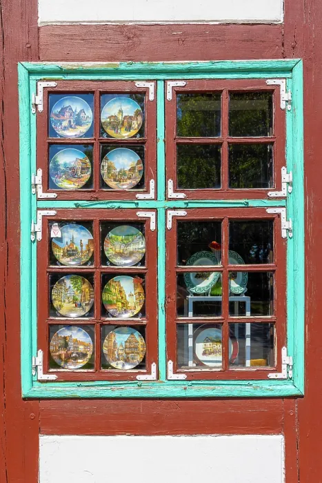 Framed Print : Decorative Plates in a Window in a Fachwerk Styled Traditional Building, Klaipeda, Lithuania
