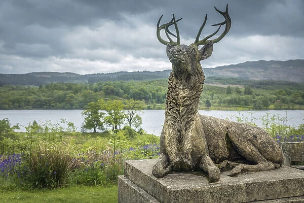 Deer statue at Castle An Tigh Mor on Loch Achray, Stirling, Scotland, Great Britain