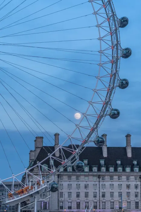 Framed Print : Details of London Eye ferris wheel with County Hall in background under the full moon Framed Print : Details of London Eye ferris wheel with County Hall in background under the full moon
