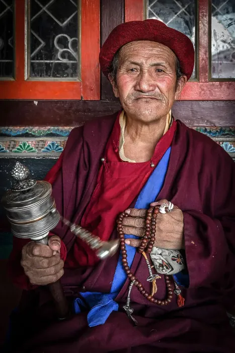 Framed Print : Devotee spinning prayer wheel at Boudhanath Stupa, Kathmandu, Nepal Framed Print : Devotee spinning prayer wheel at Boudhanath Stupa, Kathmandu, Nepal