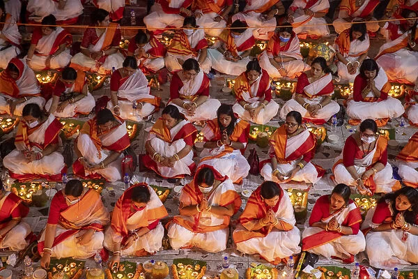 Devotees attend prayer with burning incense and light oil lamps before break fasting
