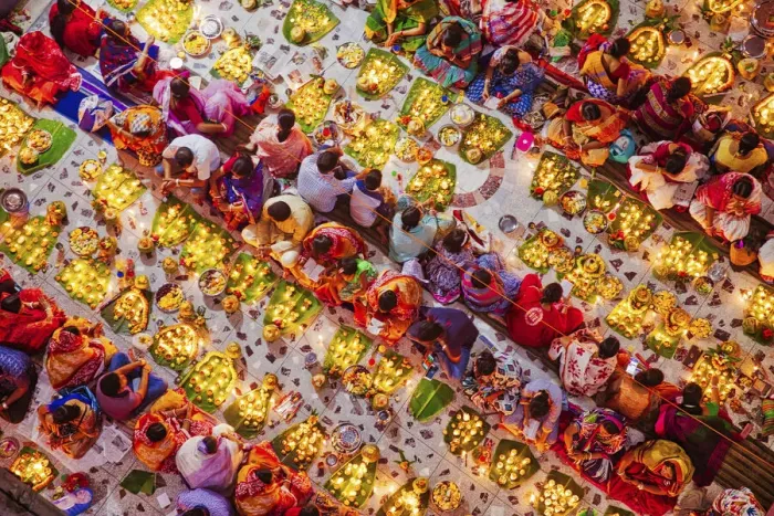 Framed Print : Devotees attend prayer with burning incense and light oil lamps before break fasting Framed Print : Devotees attend prayer with burning incense and light oil lamps before break fasting