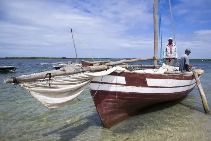 Framed Print : A dhow captain waits for high tide in the harbour of Ibo Island Framed Print : A dhow captain waits for high tide in the harbour of Ibo Island
