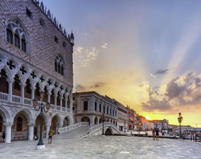 Framed Print : Doges Palace in Venice, Riva degli schiavoni, during the sunrise, with tourists Framed Print : Doges Palace in Venice, Riva degli schiavoni, during the sunrise, with tourists