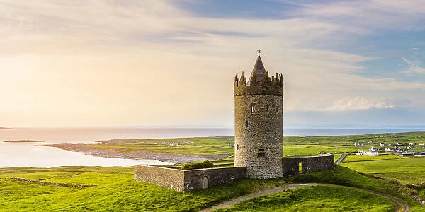 Doolin castle, County Clare, Munster province, Ireland, Europe. Panoramic view at sunset