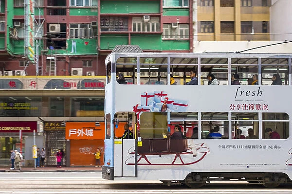 Double-Decker tram passing on Hennessy Road, Wan Chai, Hong Kong Island, Hong Kong, China