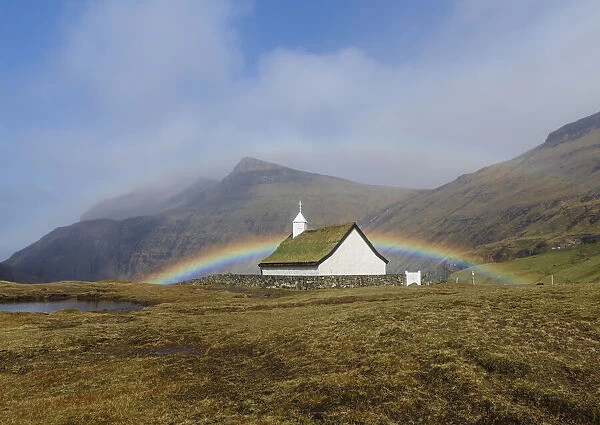 A double rainbow behind the church of Saksun. Streymoy, Faroe Islands
