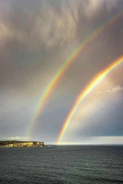 Double rainbow over North Head as a storm front moves offshore, Sydney, New South Wales, Australia