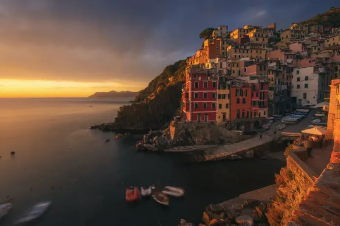 Framed Print : A dramatic autumnal sunset in Riomaggiore, Cinque Terre, where the last light of the day hit the walls of the small fishermens village Framed Print : A dramatic autumnal sunset in Riomaggiore, Cinque Terre, where the last light of the day hit the walls of the small fishermens village