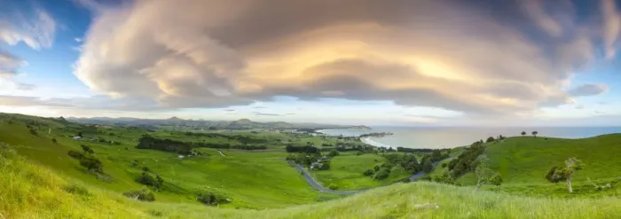 Framed Print : Dramatic cloud formations over the picturesque coastal settlement of Karitane, Otago