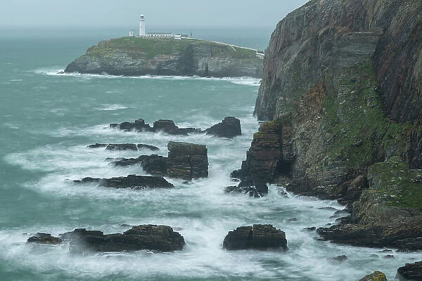 Dramatic coastal scenery at South Stack Lighthouse in Anglesey, North Wales, UK. Autumn (October) 2023