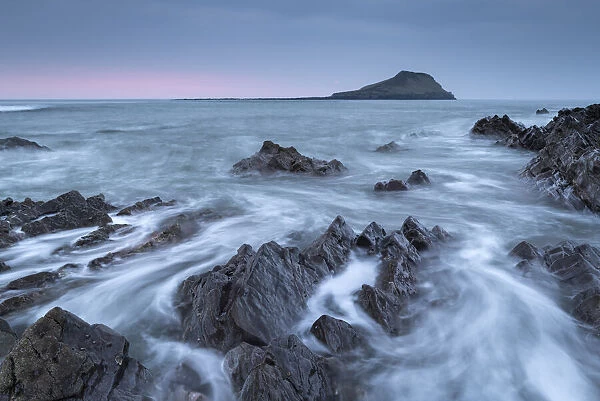 Dramatic seascape looking towards Worms Head on the Gower Peninsula, Wales. Spring (March) 2022