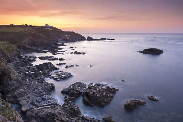 Dramatic view over Polpeor Cove to Lizard Point at sunrise, Lizard Peninsula, Cornwall