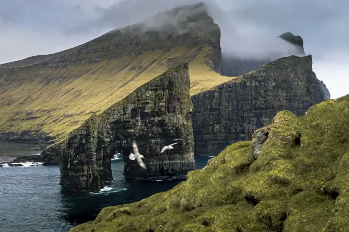 Framed Print : Drangarnir and the island of Vagar seen from Tindholmur. Faroe Islands Framed Print : Drangarnir and the island of Vagar seen from Tindholmur. Faroe Islands