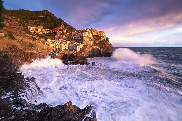 Dream sunset during a storm over the village of Manarola, Cinque Terre National Park