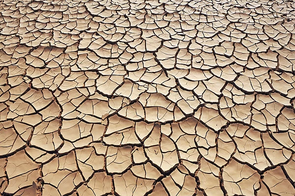 Dried out water hole in desert - Algeria, Tassili Hoggar, Tagrera - Sahara