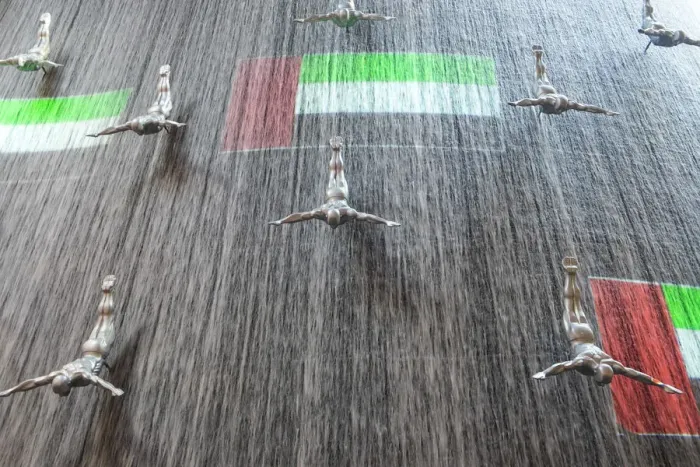 Framed Print : The Dubai Mall, Diving men sculpture & projected UAE flag, diving art statues Framed Print : The Dubai Mall, Diving men sculpture & projected UAE flag, diving art statues