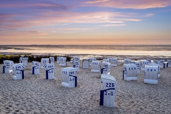 Duhnen, Cuxhaven, Lower Saxony, Germany. Strandkorb beach chairs and the Wadden Sea
