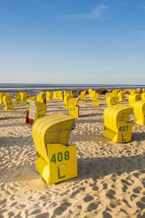 Framed Print : Duhnen, Cuxhaven, Lower Saxony, Germany. Yellow Strandkorbs along the Wadden Sea Framed Print : Duhnen, Cuxhaven, Lower Saxony, Germany. Yellow Strandkorbs along the Wadden Sea