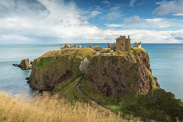Dunnottar Castle perched on a cliff top promontory south of Stonehaven, Scotland. Autumn (September) 2022