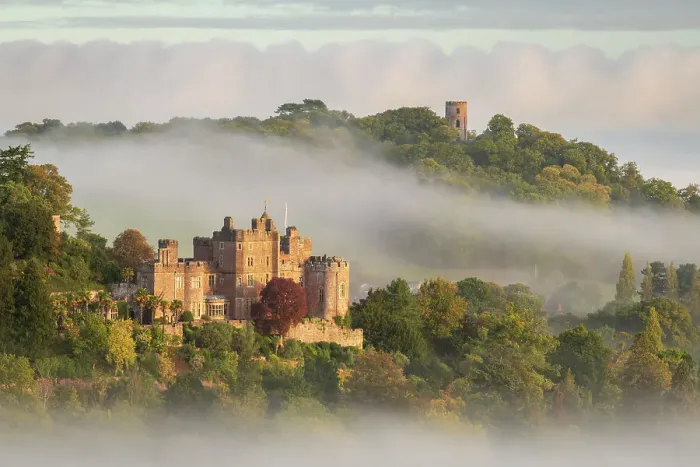 Framed Print : Dunster Castle and Conygar Tower emerging from morning mist, Dunster, Exmoor National Park, Somerset, England. Autumn (October) 2022 Framed Print : Dunster Castle and Conygar Tower emerging from morning mist, Dunster, Exmoor National Park, Somerset, England. Autumn (October) 2022