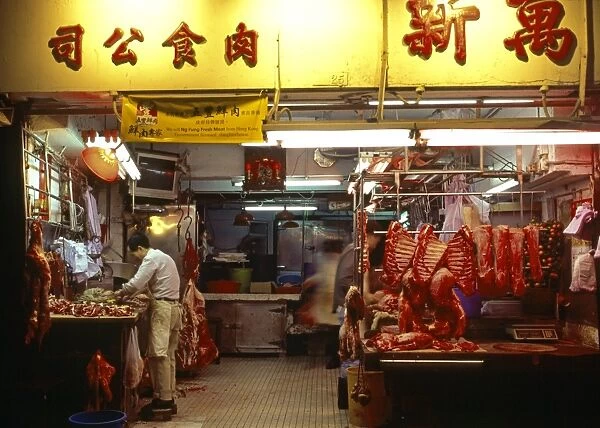 Early morning activity in a chinese butchery in the