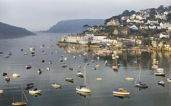 Early morning sunlight on Salcombe and the yachts in Kingsbridge Estuary, South Hams