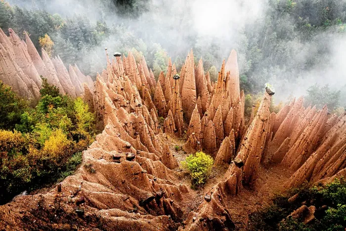 Framed Print : Earth Pyramids red rock pinnacles emerging from fog in the autumn woods, Soprabolzano, Renon / Ritten, Bolzano, South Tyrol, Italy Framed Print : Earth Pyramids red rock pinnacles emerging from fog in the autumn woods, Soprabolzano, Renon / Ritten, Bolzano, South Tyrol, Italy