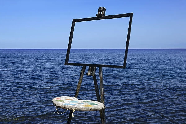 Easel and palette in front of the sea, island of Vulcano, Aeolian, or Aeolian Islands