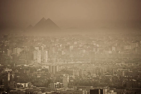 Egypt, Cairo, city skyline and pyramids in the distance, viewed from Cairo Tower