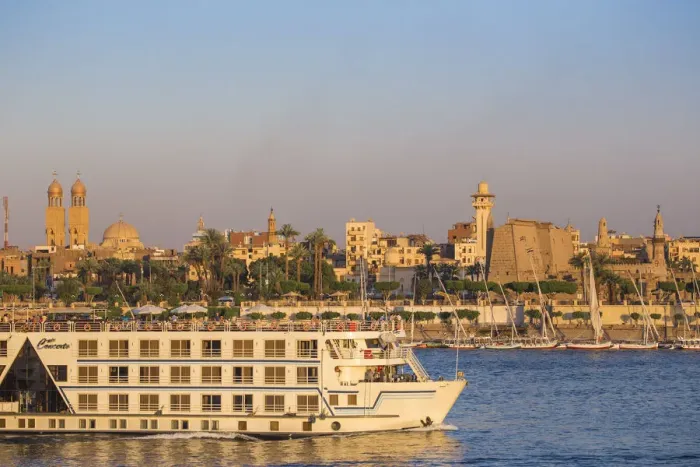 Framed Print : Egypt, Luxor, Nile cruise boat passing intont of Luxor temple