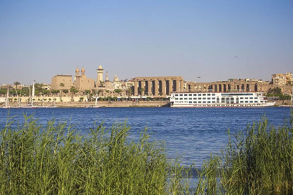 Egypt, Luxor, View of cruise boat infront of Luxor temple