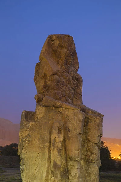 Egypt, Luxor, West Bank, Colossi of Memnan at The mortuary temple of Amenhotep 111